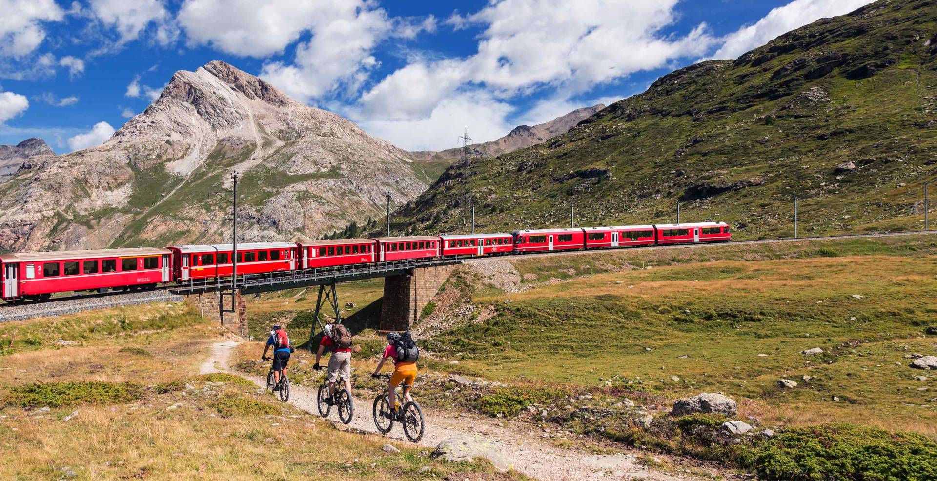 The red Bernina train crossing the Alpine viaducts